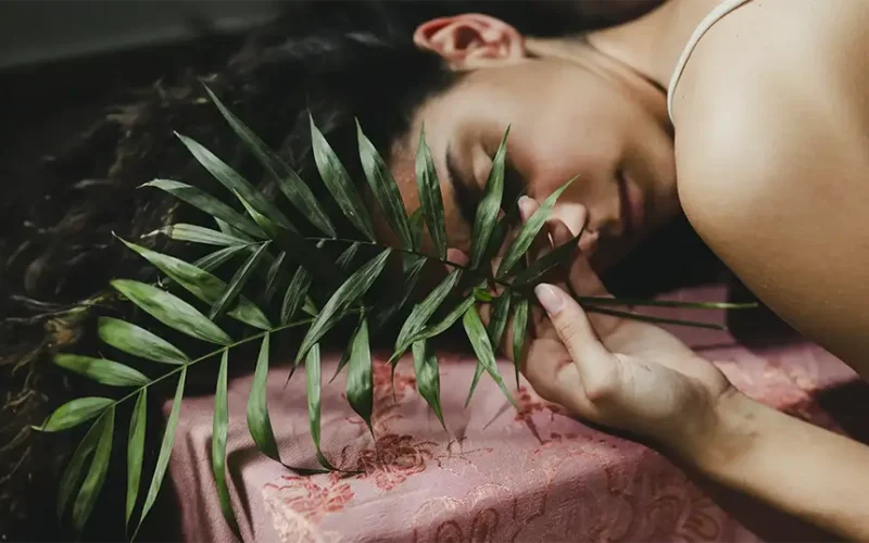 young-woman-with-leaves-sleeping